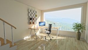 office with view through window of hills