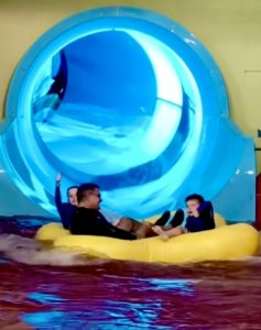 Our boys finishing the Smoke that Thunders ride at the indoor waterpark at Kalahari Resorts in Round Rock, Texas