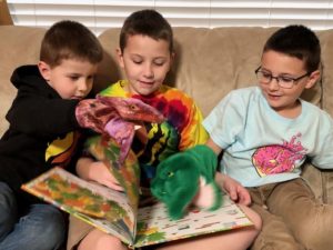 boys reading with puppets from the Round Rock Public Library