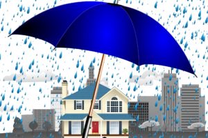 Umbrella protecting a home from rain, symbolizing home warranty coverage